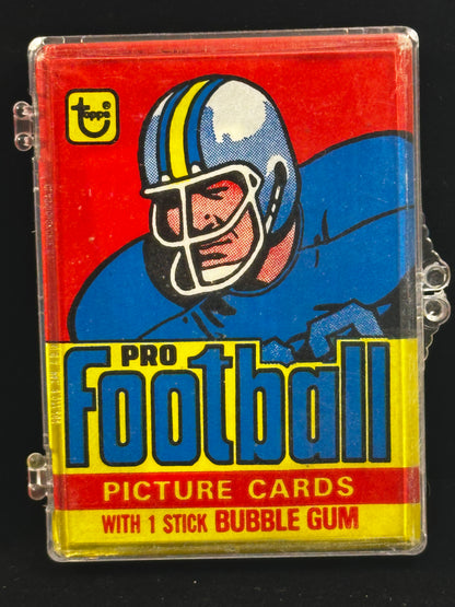 A vintage 'Pro Football Picture Cards' card deck in a clear plastic case with a red, blue, and yellow illustrated football helmet graphic, shown on a black background.