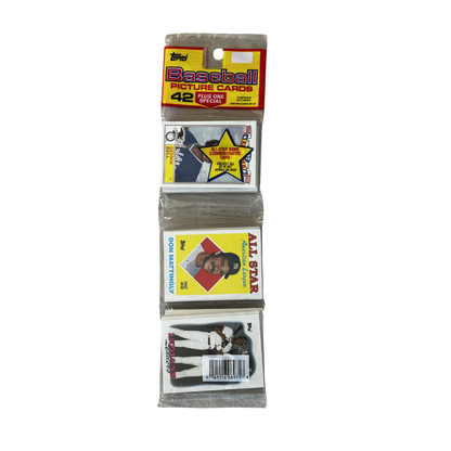 Three packs of Topps baseball cards on a white background
