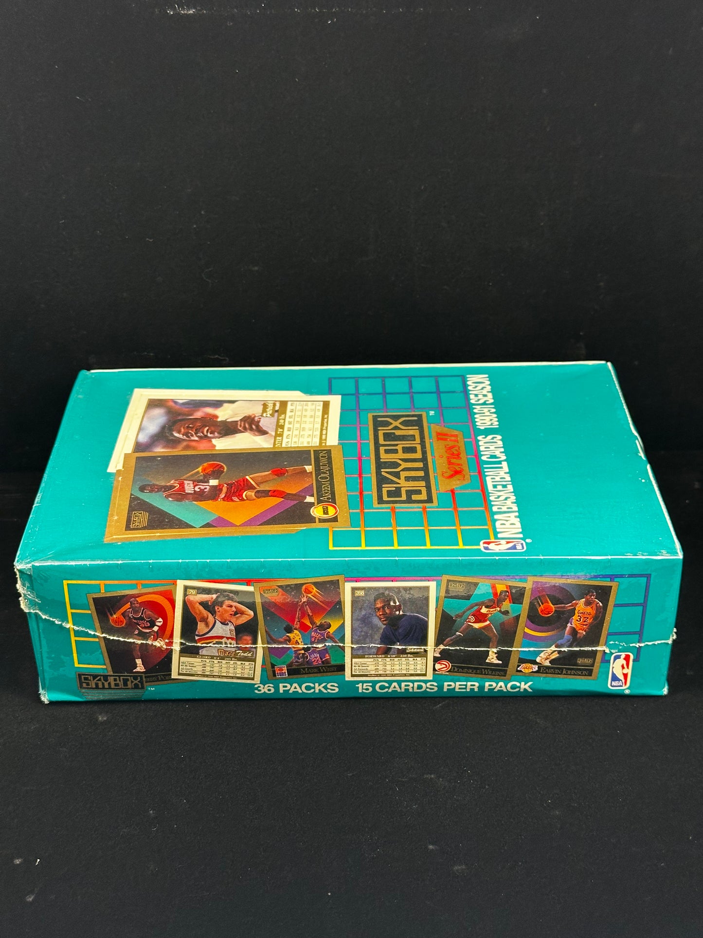 Side view of factory-sealed 1990-91 Skybox Basketball Series II trading card box with 36 packs and 15 cards per pack.