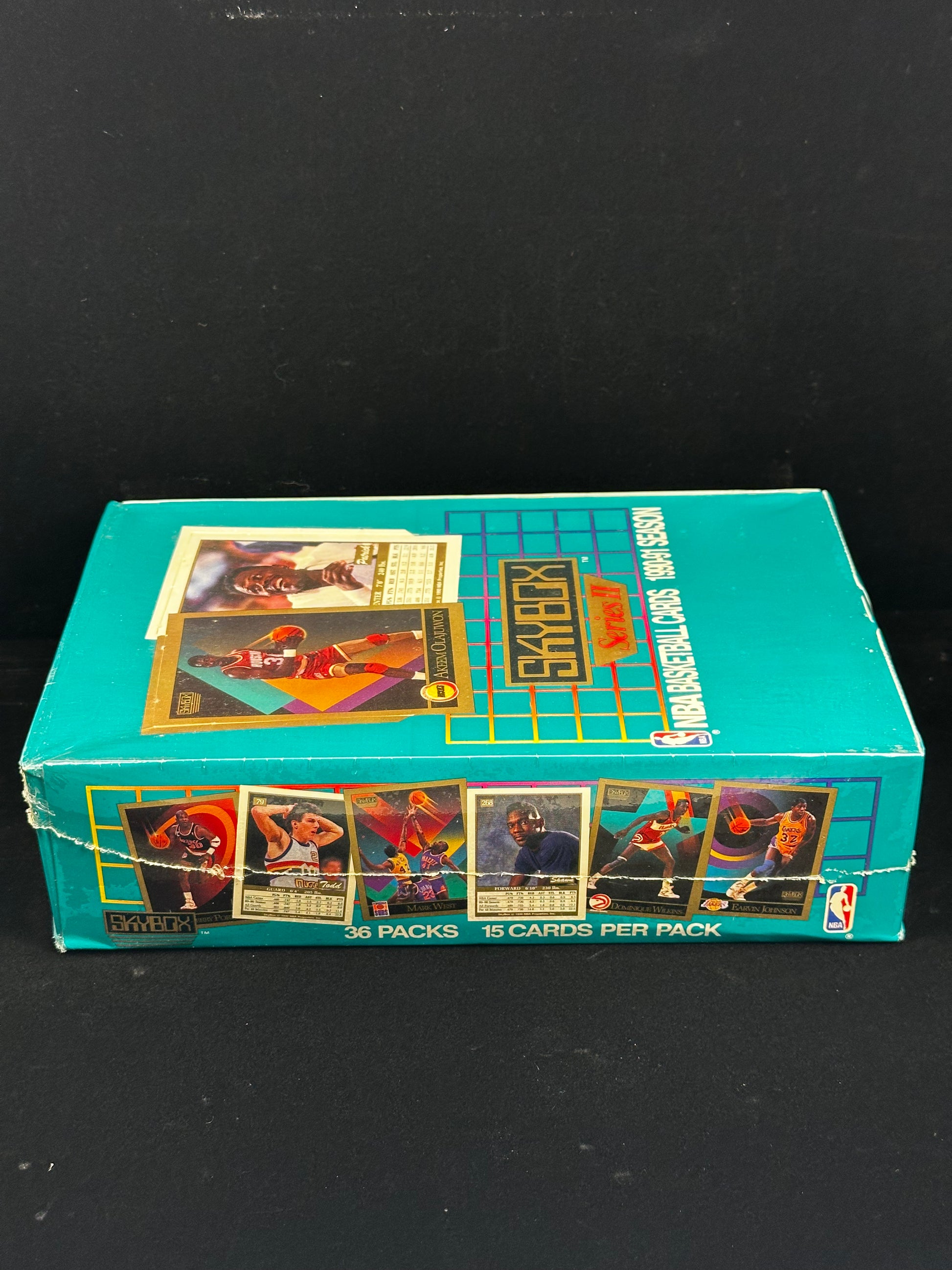 Side view of factory-sealed 1990-91 Skybox Basketball Series II trading card box with 36 packs and 15 cards per pack.