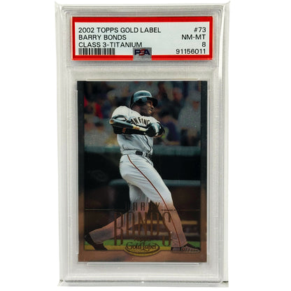A graded 2002 Topps Gold Label baseball card of Barry Bonds, sealed in a clear PSA slab. The card is numbered #73 and graded NM-MT Class 3 Titanium.