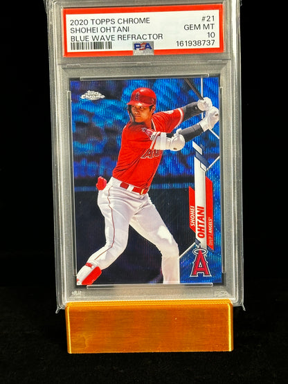 A graded 2020 Topps Chrome baseball card of Shohei Ohtani, PSA Gem Mint 10, displayed on a gold stand against a black background.