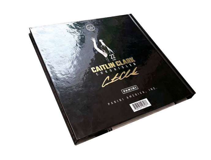 Black trading card album with 'Caitlin Clark Chronicles' branding on a white background
