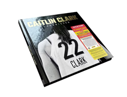 Book or magazine cover featuring a person wearing a sports jersey with number 22 and name Clark.