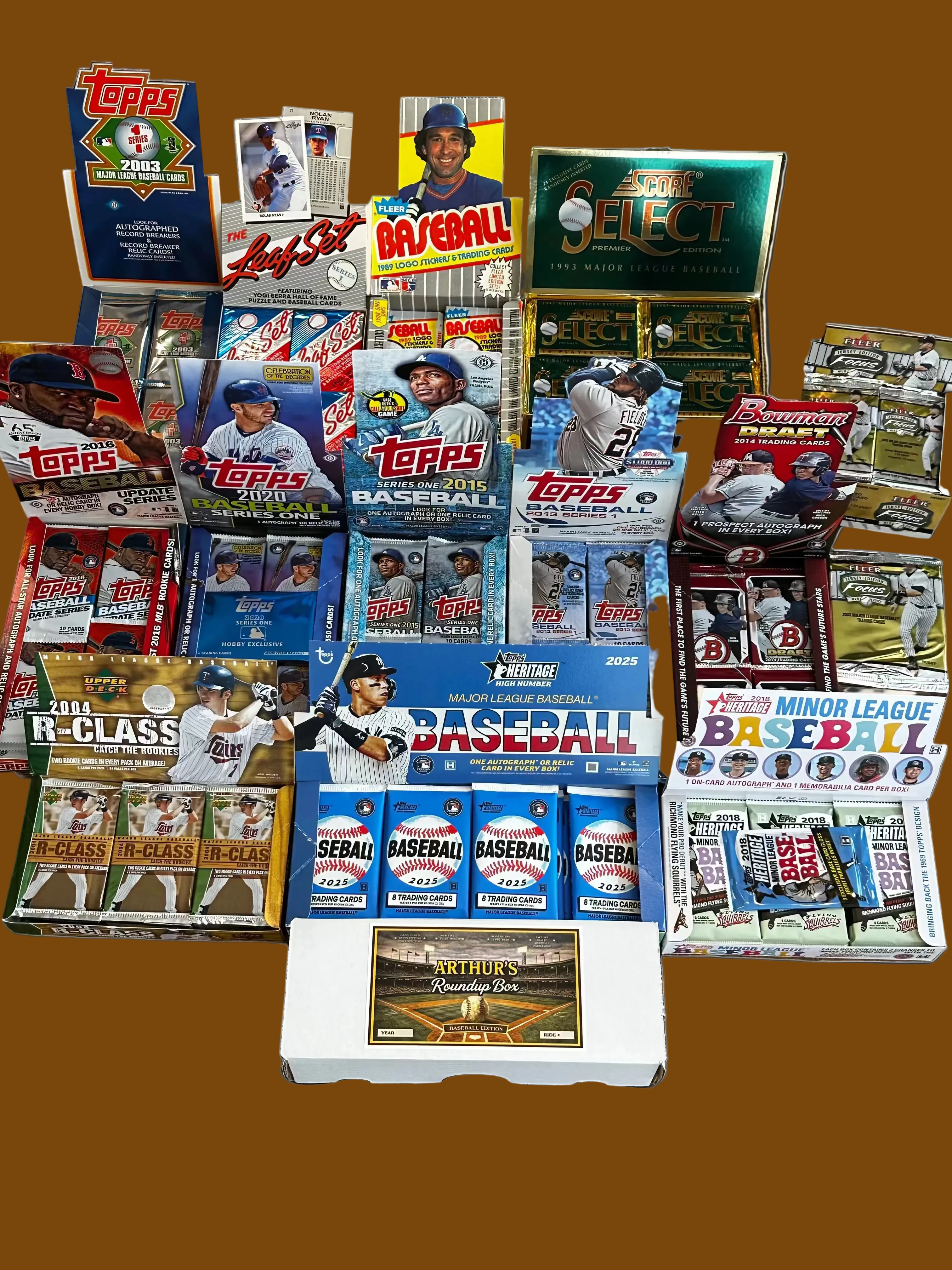 Collection of baseball trading card packs on a wooden surface