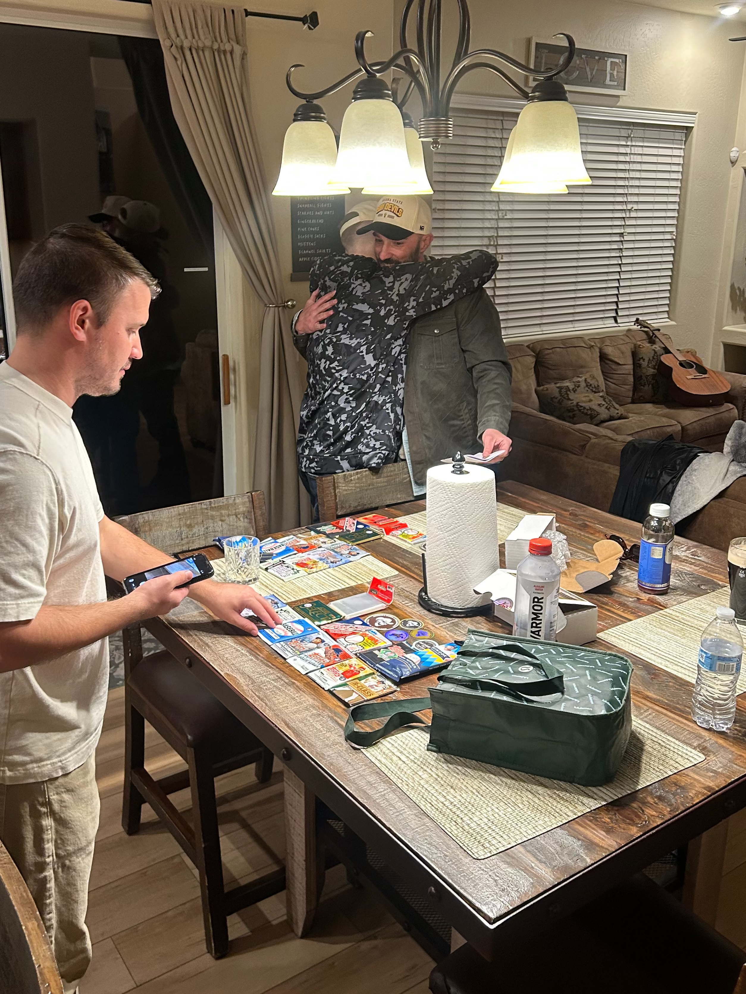 Two men playing a board game in a living room.