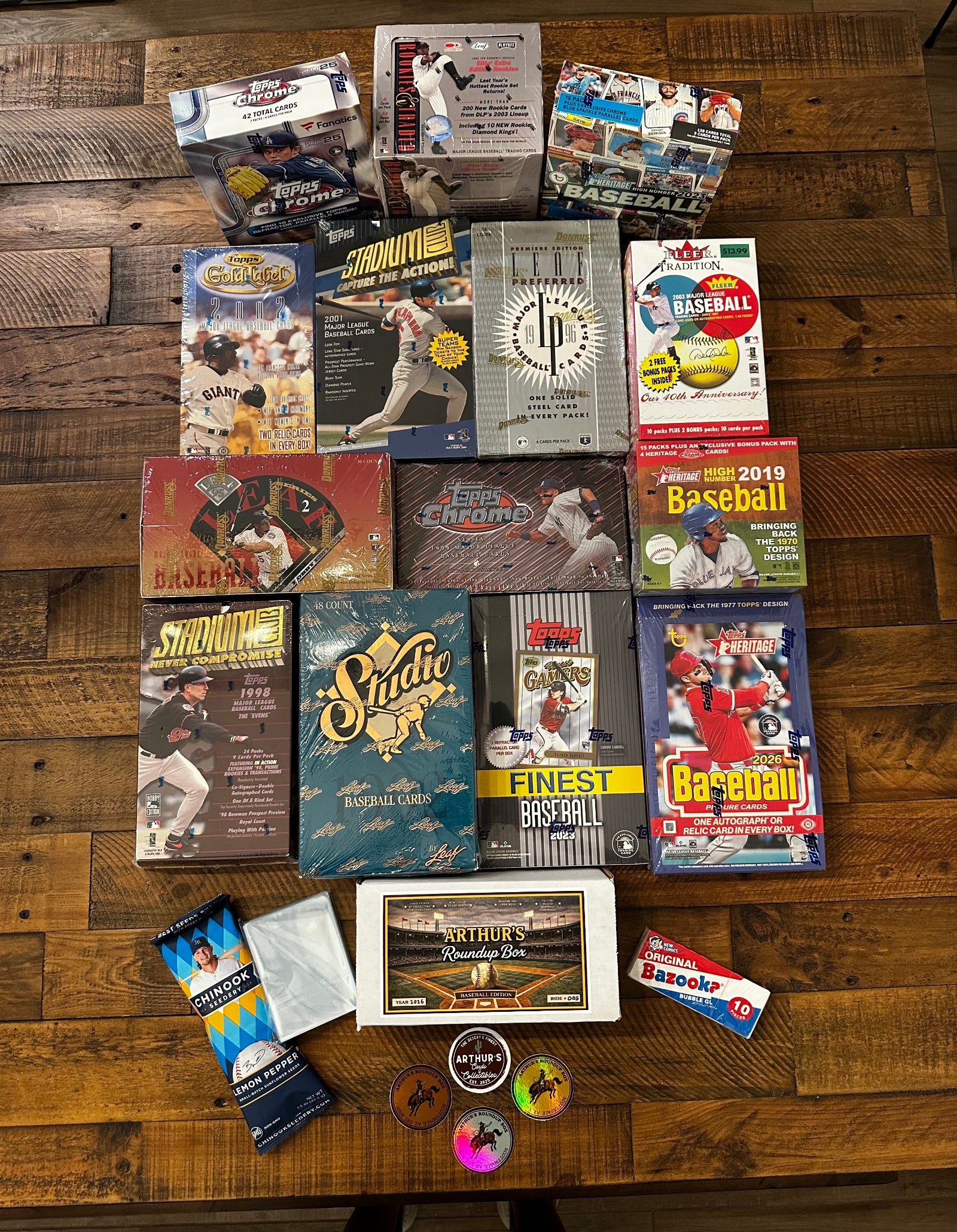Collection of baseball trading cards and related items on a wooden surface