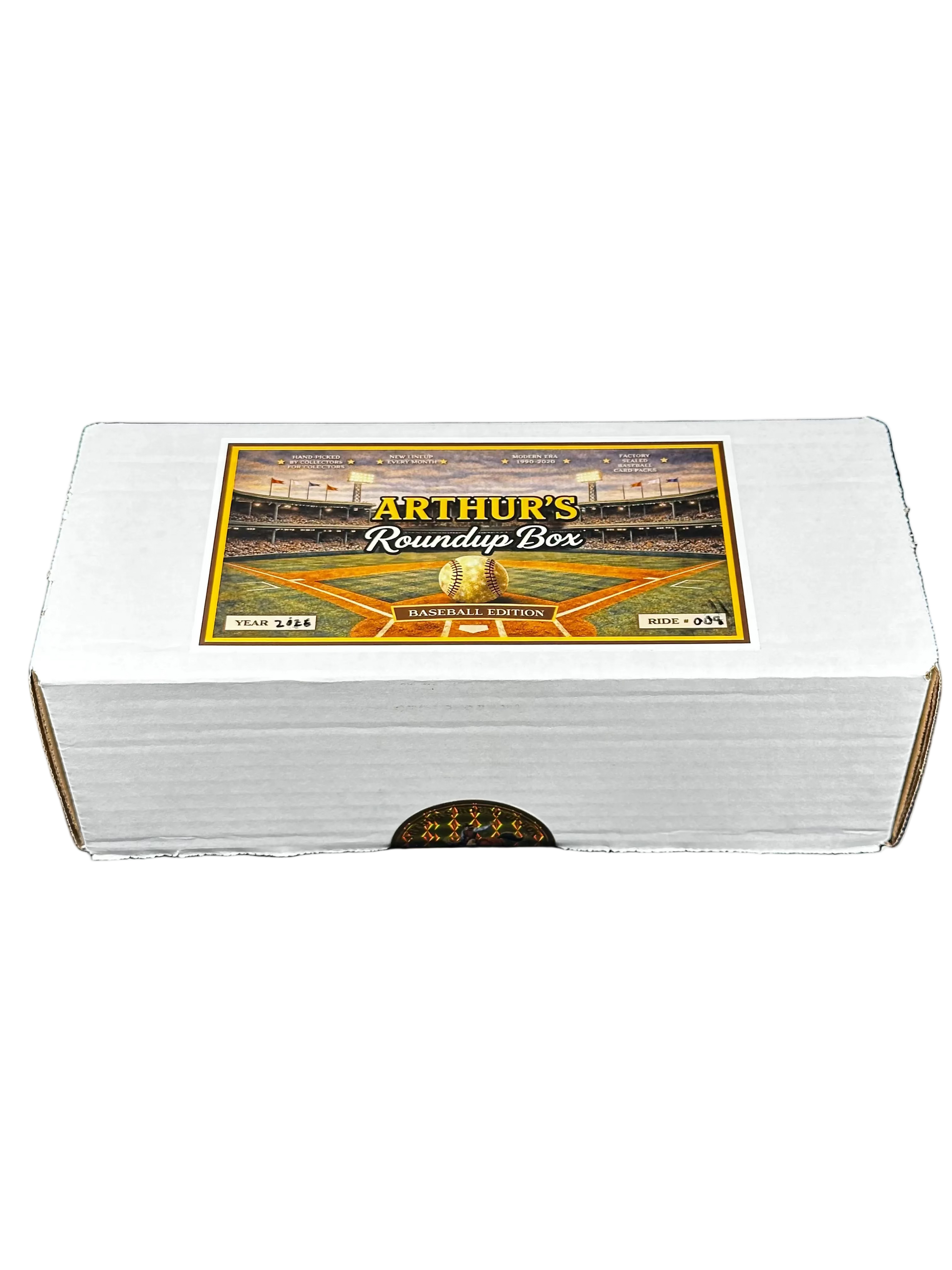 A white cardboard box labeled 'Arthur's Roundup Box' with a baseball stadium graphic on the lid, photographed against a black background.