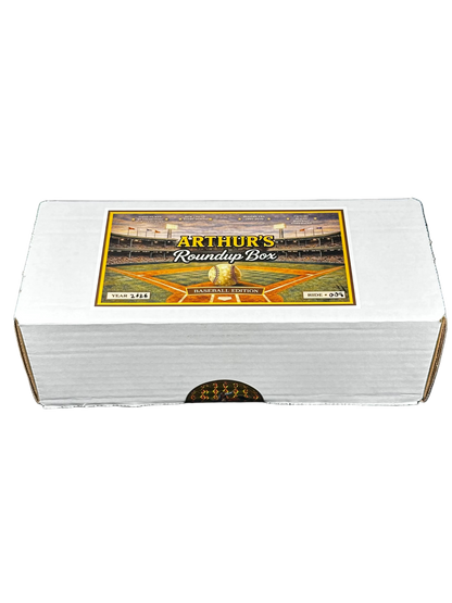A white cardboard box labeled 'Arthur's Roundup Box' with a baseball stadium graphic on the lid, photographed against a black background.