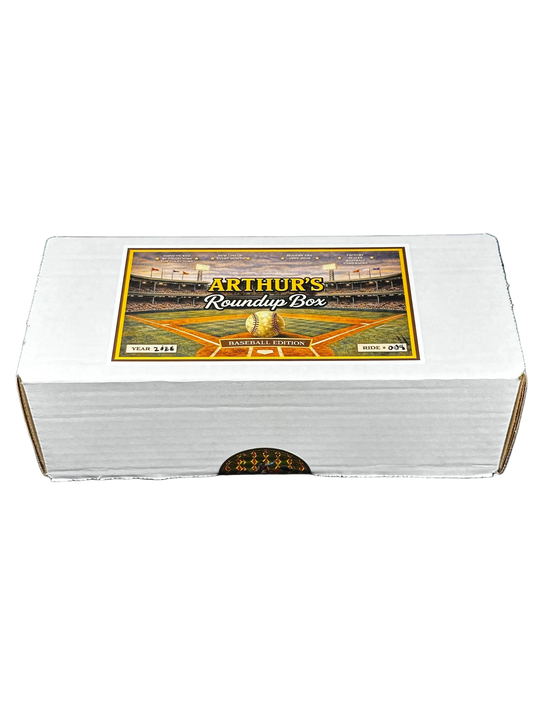 A white cardboard box labeled 'Arthur's Roundup Box' with a baseball stadium graphic on the lid, photographed against a black background.