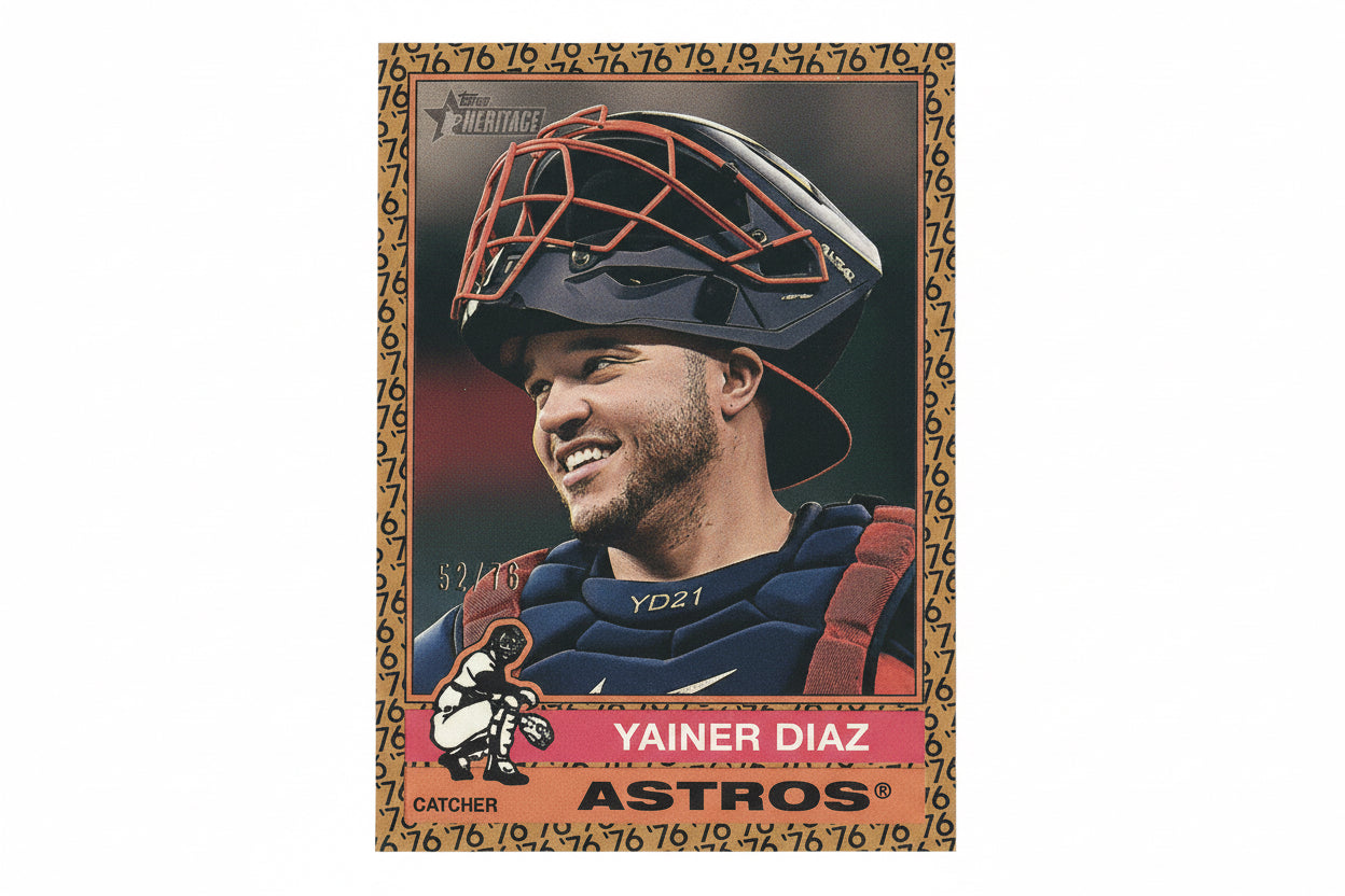 Baseball trading card of Yainer Diaz with a catcher's mask and gear on a dark background.